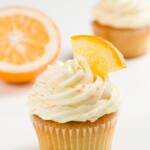 Orange frosting on vanilla cupcakes