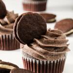 Lots of oreo cupcakes and oreos with oreo cookies and cream frosting