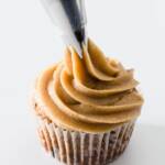 Cookie Dough Frosting being piped onto a cupcake
