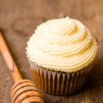 Honey cupcake with a honey swabber next to it