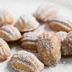 Mini Madeleines dusted with powdered sugar