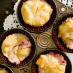 overhead view of a muffin tin loaded with mini cranberry cheese danishes