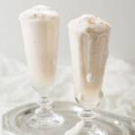 looking down slightly at two syllabub cocktails on a silver tray