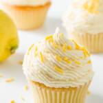 Several cupcakes frosted with lemon buttercream frosting