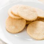 White plate filled with a pile of honey cookies