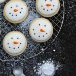 Snowmen cookies on a cooling rack