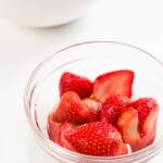 A bowl of glistening macerated strawberries