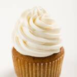 tight shot of a cupcake frosted with Italian meringue buttercream frosting