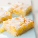 A few pineapple bars on a blue serving plate