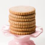 stack of cinnamon sugar cookies on a small pink stand