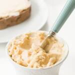 Maple butter in a ramekin with a knife in it and toast in the background